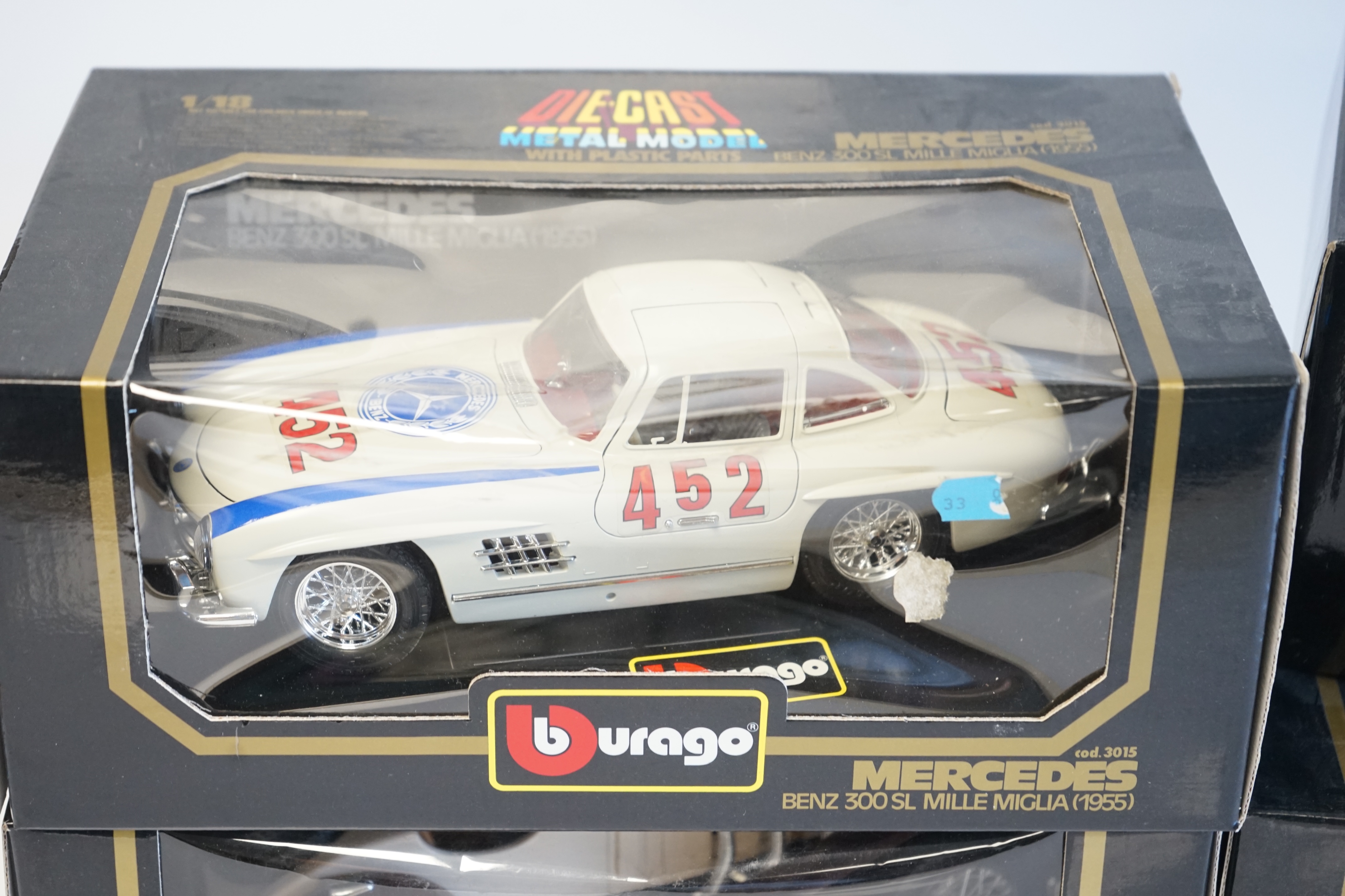 Six boxed Burago Diecast racing cars, five in 1/18 scale including; a Mercedes-Benz SSK, a Mercedes-Benz 300SL, a Jaguar SS100, a Lancia Aurelia B24 spider and an Alfa Romeo 2300 spider, together with a 1/24 scale Ford A